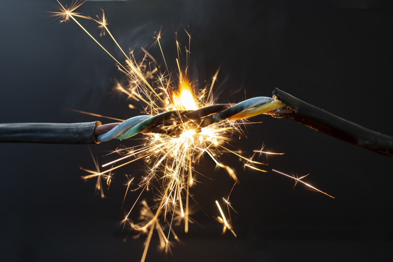 Flame, smoke, and sparks on electrical wiring and cables indicate a serious fire hazard.