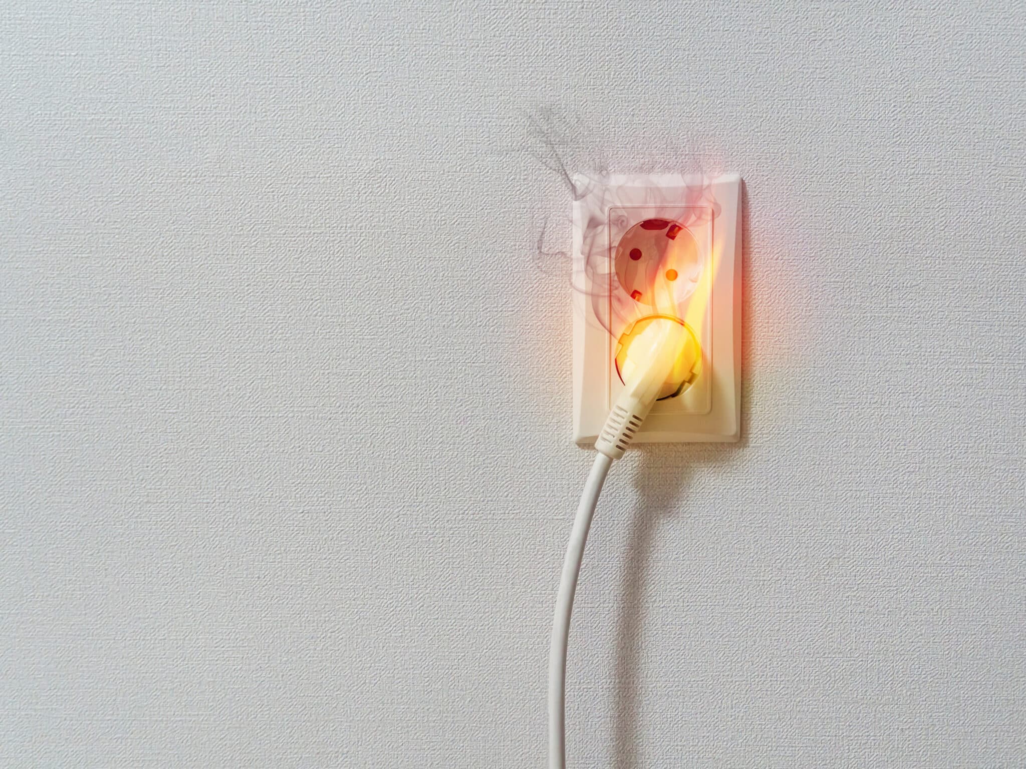 Fire and smoke on electric wire plug, Electrical Outlet Testing.