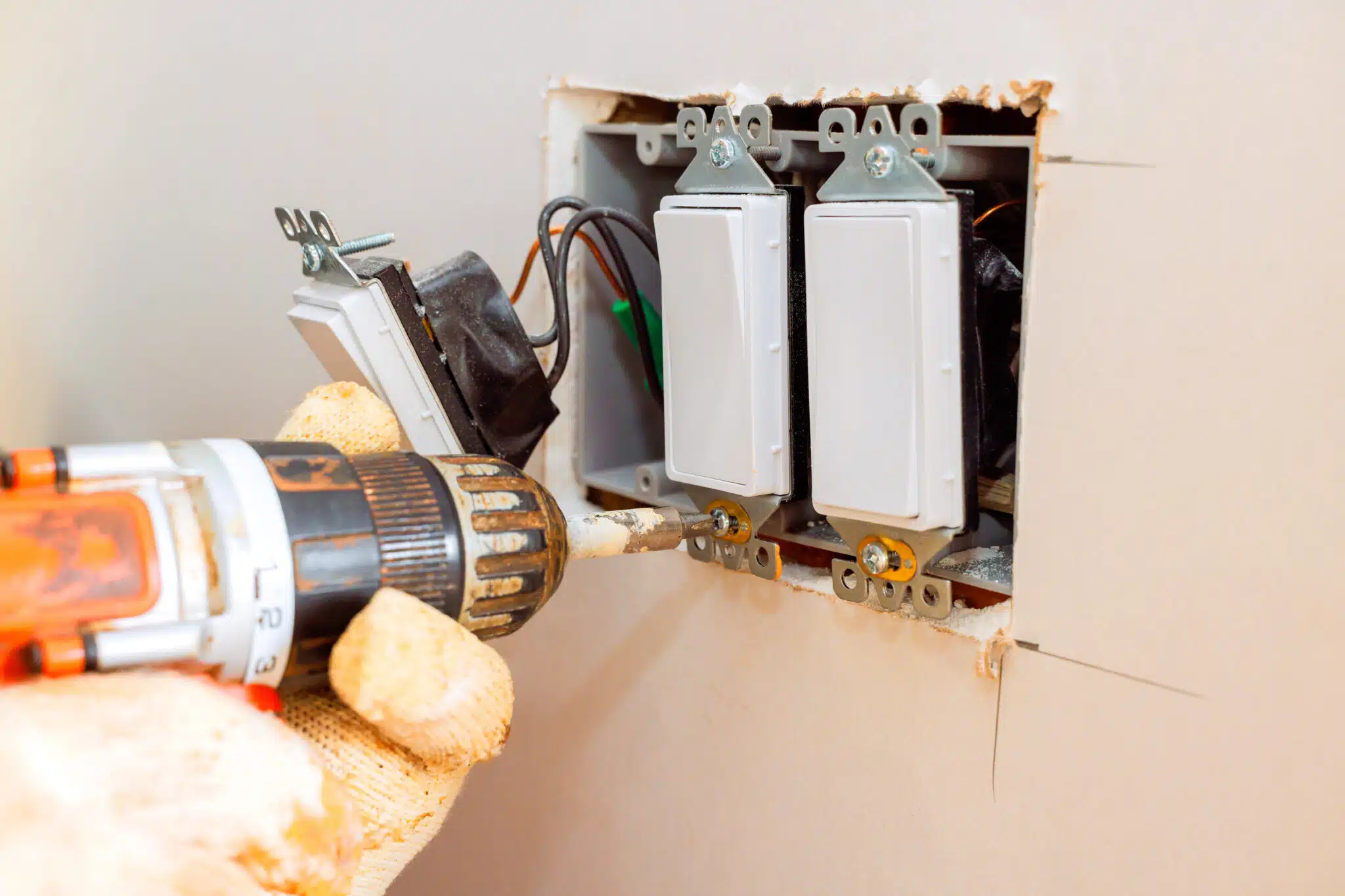 Home electrical upgrade in progress with careful modifications to wall switches outlets, Dimmer Switch Installation.